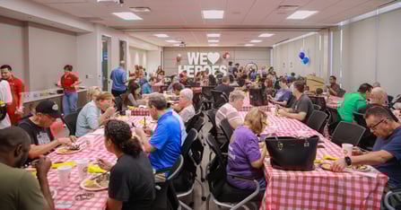 Overview shot of attendees enjoying their Rudy's BBQ lunch